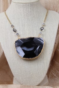 Large faceted agate pendant on gold necklace