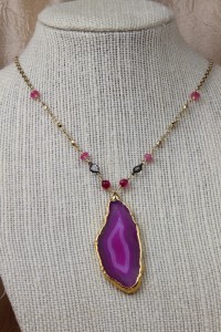 Ping agate slice on gold necklace