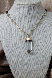 Quartz pendant on gold necklace